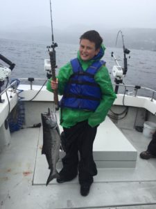 child catches salmon